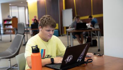Student working on a laptop